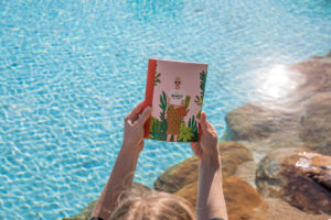 This is an image of a law student with her funky notebook by the pool.